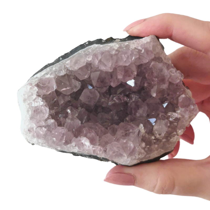 light lilac Amethyst cluster size 65x88mm held by hand