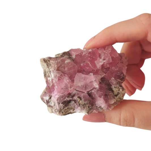 high quality rare hot pink Cobaltoan Calcite cluster 70mm long held by hand top view