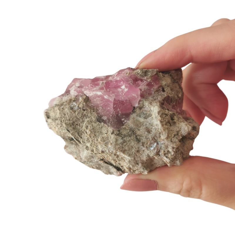 high quality rare hot pink Cobaltoan Calcite cluster 70mm long held by hand back view