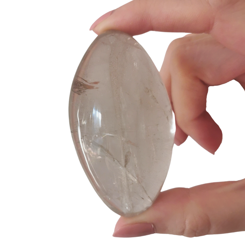 rounded polished light grey high quality Smoky Quartz with inclusions and possibly rainbows within palm crystal held by hand